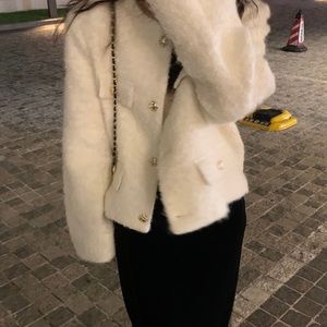 White fur coat with pockets